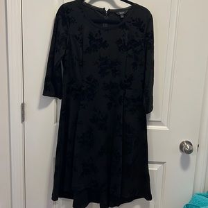 Solid black dress with velvet floral accents